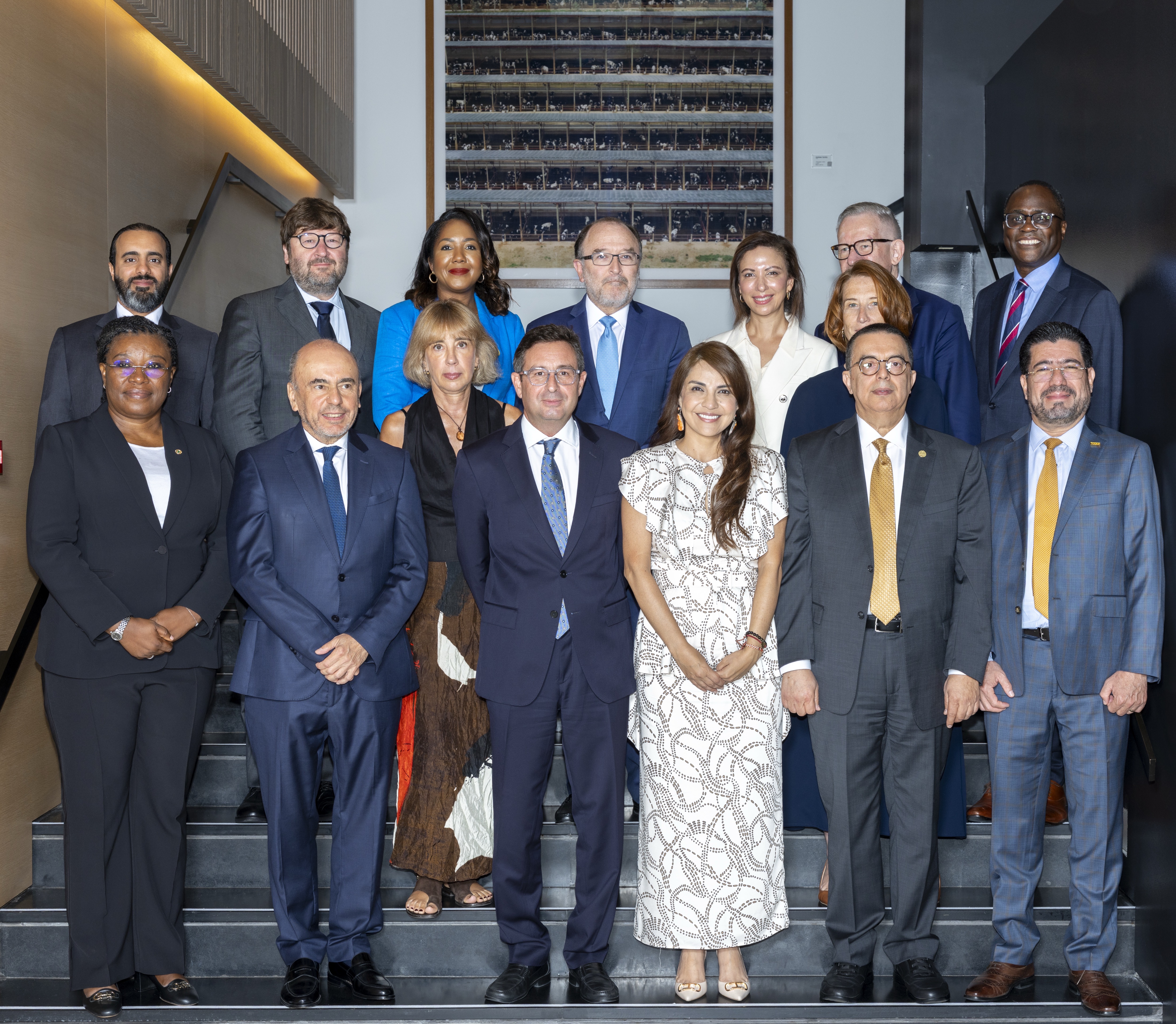 Group photo of Secretaries Generals from international financial institutions standing in front of the event backdrop at the 27th Annual Meeting of IFI Secretaries in Thessaloniki.