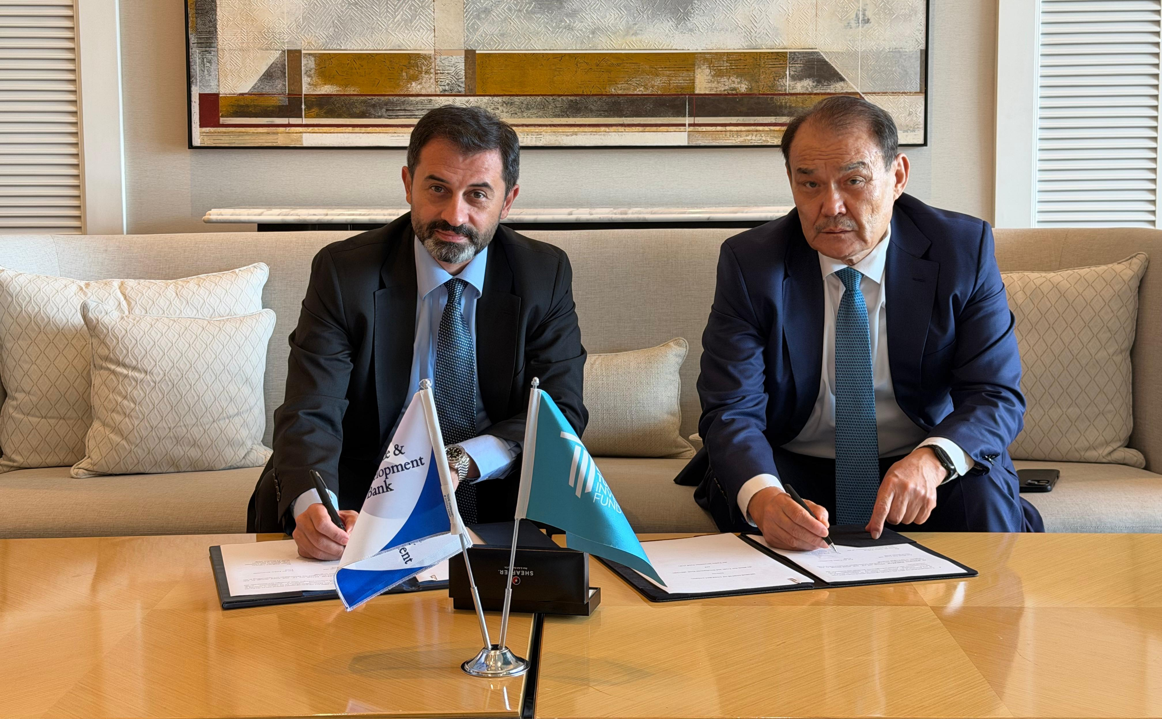 BSTDB President Dr. Serhat Köksal and TIF President Baghdad Amreyev signing the Memorandum of Understanding.
